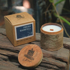 Le Rustique Aroma Candle with packaging labeled 'Fresh Rainfall' on a wooden surface