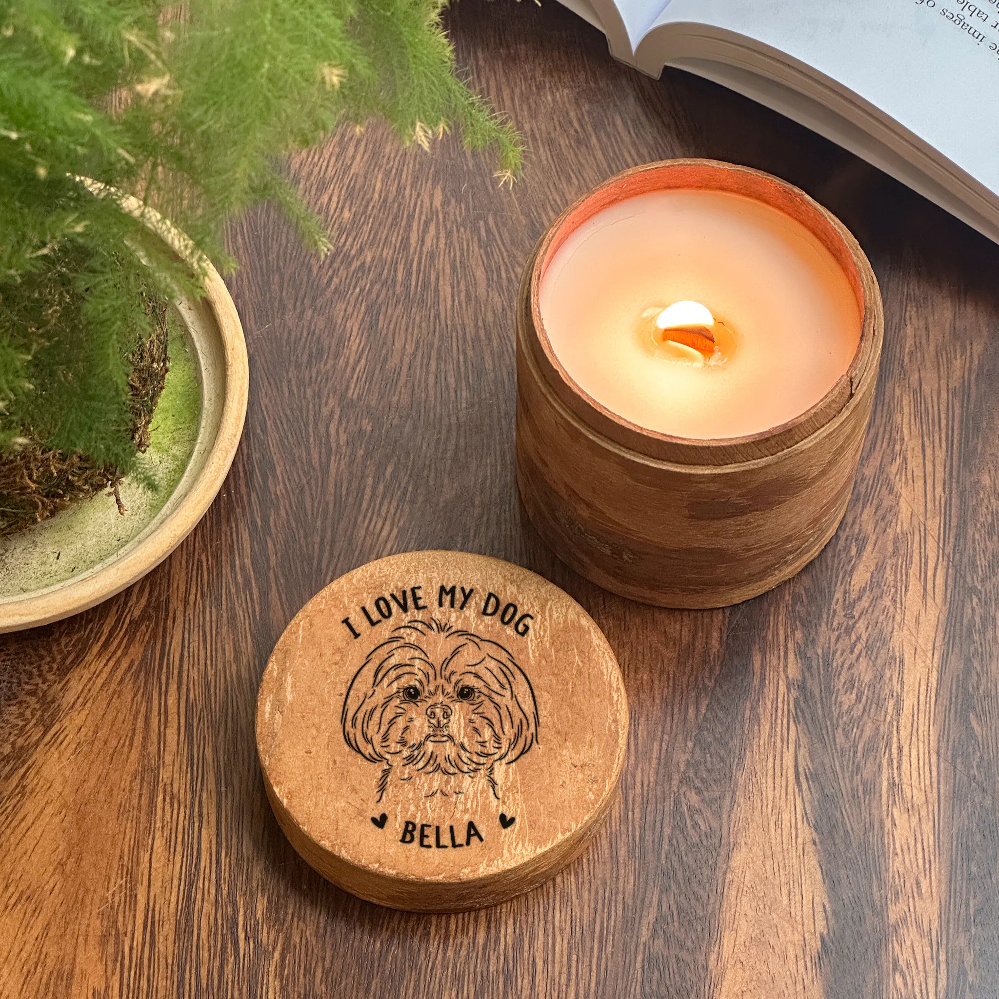 Custom scented candle with engraved lid on a cinnamon surface