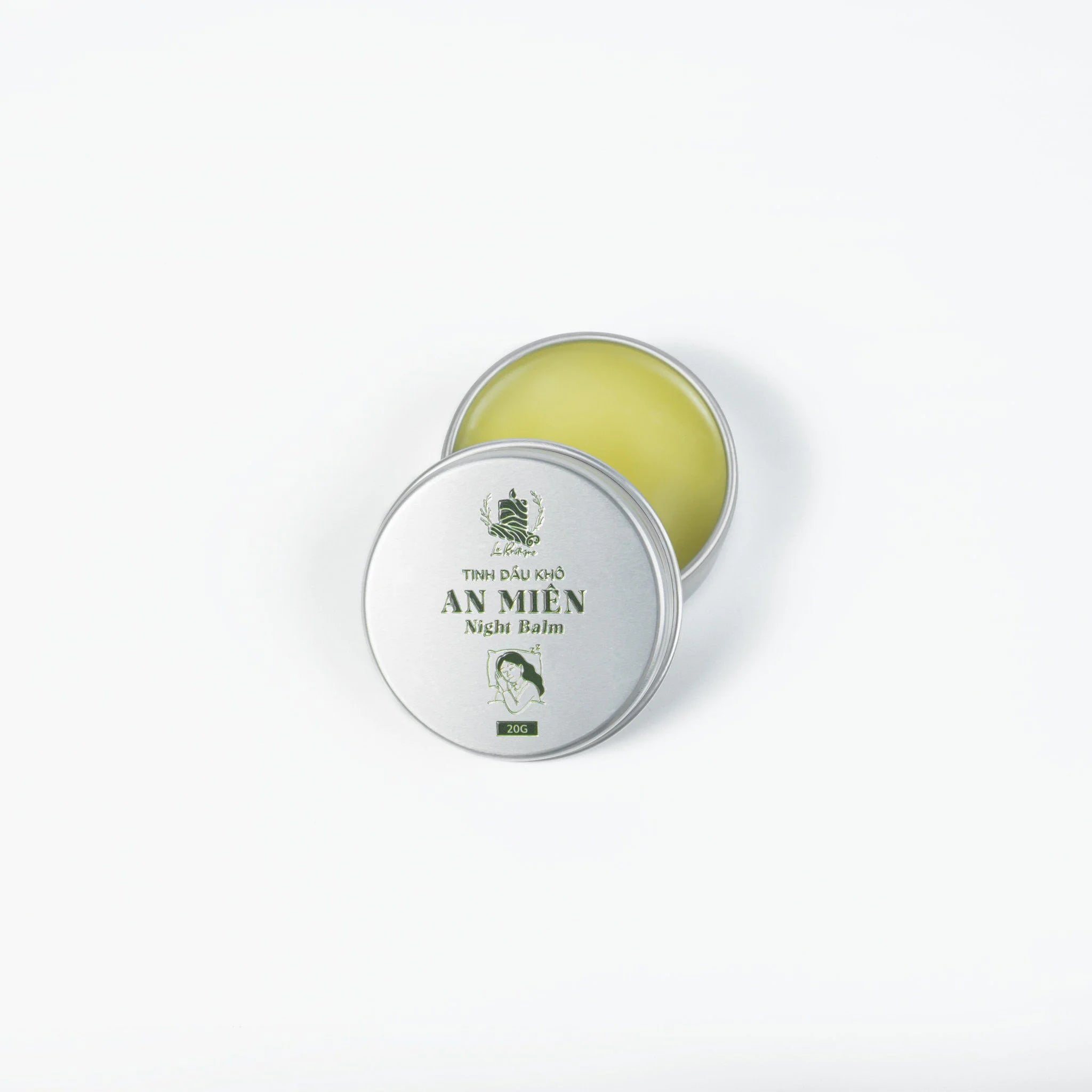 Le Rustique Night Balm tin with natural essential oils for nighttime relaxation and moisturizing.