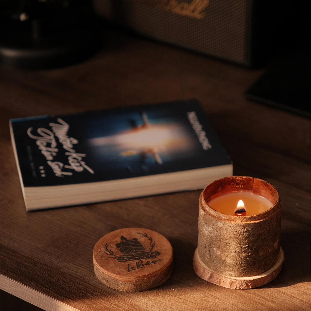 relaxing with soy wax scented candle and book