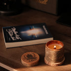 relaxing with soy wax scented candle and book