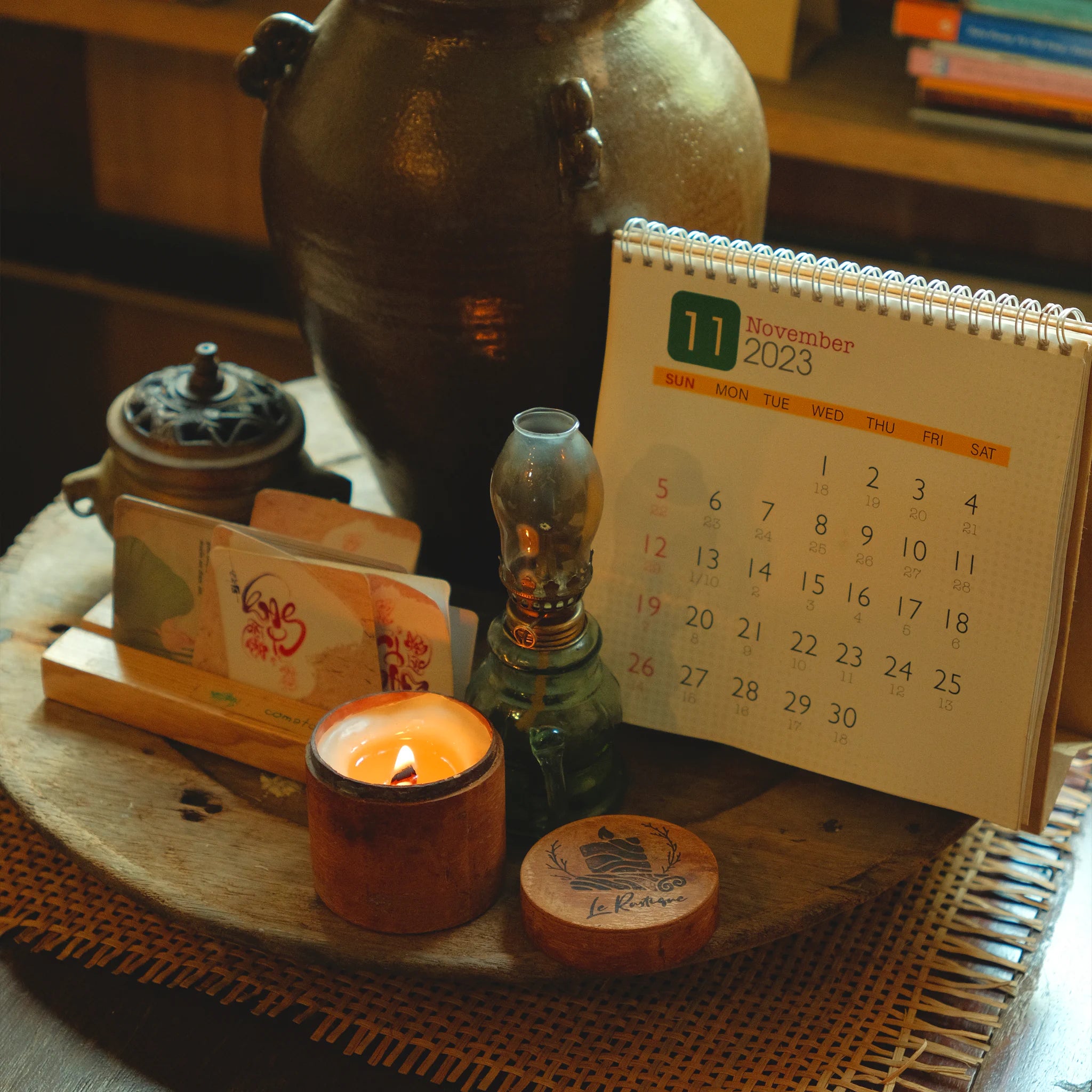 Aromatherapy Candle on a table with vintage decorative items.
